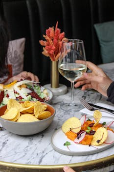young person with smartphone and calculator